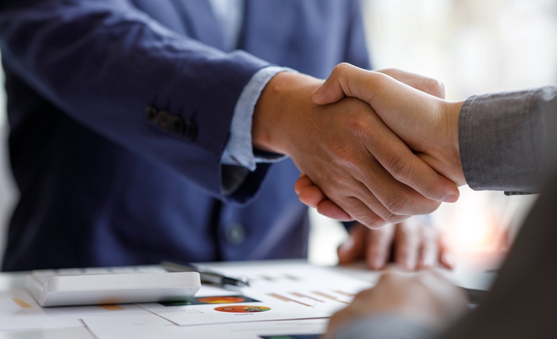 Financial Business handshake for teamwork of business merger and